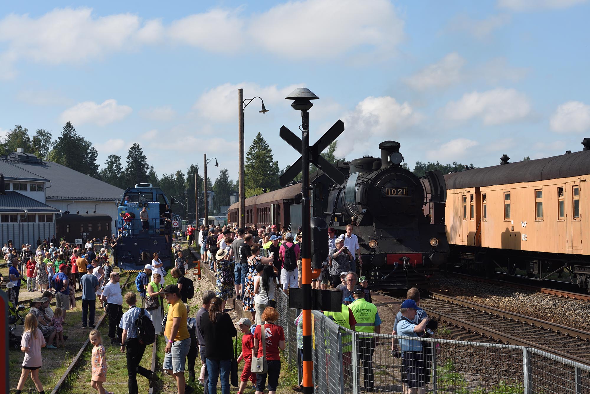 Lots of people and rolling stock on the Railway Museum Day on museum´s railway yard.